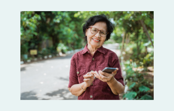 Canva stock photo–senior Asian female with mobile phone