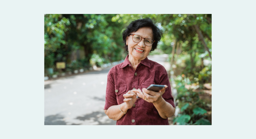 Canva stock photo–senior Asian female with mobile phone